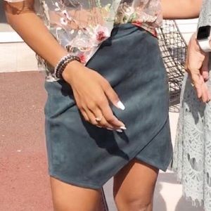 Asymmetrical emerald green velvet mini skirt